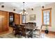 An elegant dining room featuring a coffered ceiling, wood floors, and natural light at 1143 S Saint Paul St, Denver, CO 80210