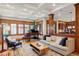 Comfortable living room with a piano, large windows, and an open layout at 1143 S Saint Paul St, Denver, CO 80210