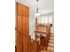 A second-story view of the staircase, wood railings, and an abundance of natural light at 1143 S Saint Paul St, Denver, CO 80210