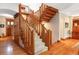 A beautiful staircase with wood railings, carpeted treads, and detailed wood trim at 1143 S Saint Paul St, Denver, CO 80210