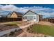 The backyard features a patio, turf and gravel landscaping, as well as a small detached dwelling at 55490 E 27Th Pl, Strasburg, CO 80136