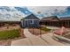 The backyard features a patio, turf and gravel landscaping, as well as a small detached dwelling at 55490 E 27Th Pl, Strasburg, CO 80136