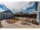 The backyard features a patio, turf and gravel landscaping, as well as a small detached dwelling at 55490 E 27Th Pl, Strasburg, CO 80136