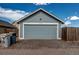 A detached garage has a single car garage door with horizontal panels and the address number '55490' at 55490 E 27Th Pl, Strasburg, CO 80136