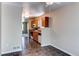 Bright kitchen with tile floors, wooden cabinets, and stainless steel appliances. A ceiling fan adds extra comfort at 55490 E 27Th Pl, Strasburg, CO 80136