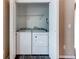 In-unit, stacked laundry closet includes a washer and dryer at 55490 E 27Th Pl, Strasburg, CO 80136