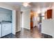 Functional laundry room features a washer and dryer, providing convenience at 55490 E 27Th Pl, Strasburg, CO 80136