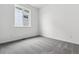 Clean bedroom with neutral carpet, baseboard trim and natural light coming from the window at 39161 Anthony St, Elizabeth, CO 80107