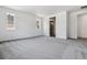 Bedroom with natural light, neutral walls, carpet, and hallway view of bathroom at 39161 Anthony St, Elizabeth, CO 80107