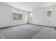 Carpeted bedroom with natural light, complemented by neutral walls and views to the outside at 39161 Anthony St, Elizabeth, CO 80107