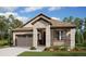 Charming single-story home featuring stone accents, a covered porch, and a manicured front lawn at 39161 Anthony St, Elizabeth, CO 80107