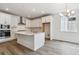 Stylish kitchen boasts a central island, stainless appliances, and modern fixtures at 39161 Anthony St, Elizabeth, CO 80107