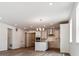 View of the living room adjacent to the kitchen, featuring hardwood flooring at 39161 Anthony St, Elizabeth, CO 80107