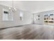Bright living room with hardwood flooring and large windows showing exterior views at 39161 Anthony St, Elizabeth, CO 80107