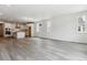 Spacious living area leads to modern kitchen with hardwood flooring and natural lighting at 39161 Anthony St, Elizabeth, CO 80107