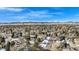 Panoramic aerial view showcasing neighborhood homes with mountain views on a clear day at 5121 W Plymouth Dr, Littleton, CO 80128