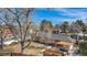 Large, leafy tree overlooks the yard and patio area at 5121 W Plymouth Dr, Littleton, CO 80128