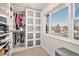 Organized walk-in closet with custom shelving and storage solutions, offering ample space for clothing and accessories at 5121 W Plymouth Dr, Littleton, CO 80128