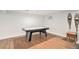 Game room featuring a shuffleboard table with carpeted floors and natural light at 5121 W Plymouth Dr, Littleton, CO 80128