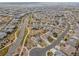 Wide aerial view of a neighborhood showcasing a well-planned community with uniform housing and landscaped streets at 4280 Crystal Dr, Broomfield, CO 80023