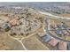 Aerial view of community clubhouse, pool, parking lot, and neighborhood at 4280 Crystal Dr, Broomfield, CO 80023