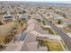 Aerial view of a house with solar panels on the roof and surrounding houses at 4280 Crystal Dr, Broomfield, CO 80023