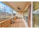 Inviting back porch with stone accents, wood ceiling, and fan at 4280 Crystal Dr, Broomfield, CO 80023