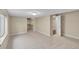 Spacious basement bedroom with walk-in closet and neutral carpeting at 4280 Crystal Dr, Broomfield, CO 80023