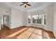 Hardwood floor bedroom with bay window and door at 4280 Crystal Dr, Broomfield, CO 80023