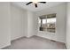 Bright bedroom with neutral carpeting and ceiling fan at 4280 Crystal Dr, Broomfield, CO 80023