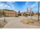 Clubhouse view with stone and tan exterior, tasteful landscaping, and ample parking at 4280 Crystal Dr, Broomfield, CO 80023