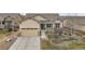 Ranch style home with a landscaped yard and two-car garage at 4280 Crystal Dr, Broomfield, CO 80023