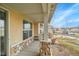Covered porch with stone accents and a view of the neighborhood at 4280 Crystal Dr, Broomfield, CO 80023