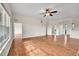 Open living room with hardwood floors and high ceilings at 4280 Crystal Dr, Broomfield, CO 80023