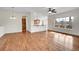 Spacious living room with hardwood floors, kitchen, and backyard view at 4280 Crystal Dr, Broomfield, CO 80023