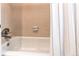 Bathtub with tiled wall and shower curtain at 4621 S Fraser Cir # A, Aurora, CO 80015