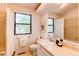 Well-lit bathroom with large mirror and ample natural light from the window at 4621 S Fraser Cir # A, Aurora, CO 80015