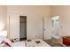 Bedroom with plush carpet, closet and a view of a hallway at 4621 S Fraser Cir # A, Aurora, CO 80015