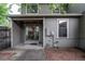 View of covered patio featuring string lights and sliding glass doors to the dining area at 4621 S Fraser Cir # A, Aurora, CO 80015