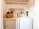 Convenient laundry room equipped with modern washer and dryer units at 4621 S Fraser Cir # A, Aurora, CO 80015