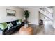 Stylish living room showcasing modern decor, comfortable seating, and a staircase at 4621 S Fraser Cir # A, Aurora, CO 80015