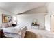 Comfortable main bedroom featuring neutral carpet, an airy atmosphere, and a view of the vaulted ceiling at 4621 S Fraser Cir # A, Aurora, CO 80015