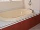 Bathroom featuring a soaking tub, neutral color scheme and updated fixtures at 11299 E 159Th Pl, Brighton, CO 80602