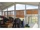 Bright sunroom with large windows and access to the backyard at 11299 E 159Th Pl, Brighton, CO 80602