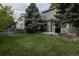 Backyard featuring well-maintained lawn, trees, and a barbecue grill, perfect for outdoor gatherings at 11538 Hudson St, Thornton, CO 80233