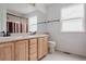 Bathroom featuring double sinks, tile floors, and a shower/tub combo at 11538 Hudson St, Thornton, CO 80233