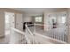 Upstairs living room featuring a comfortable leather sofa and access to other rooms at 11538 Hudson St, Thornton, CO 80233