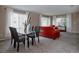 Bright living room with a glass table, plush seating, and lots of natural light at 11538 Hudson St, Thornton, CO 80233