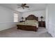 Main bedroom featuring a large bed, ceiling fan, and bedside tables, creating a luxurious retreat at 11538 Hudson St, Thornton, CO 80233