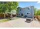 Spacious backyard area featuring a patio, grassy area, basketball hoop, grill, and table at 2691 E 132Nd Ave, Thornton, CO 80241